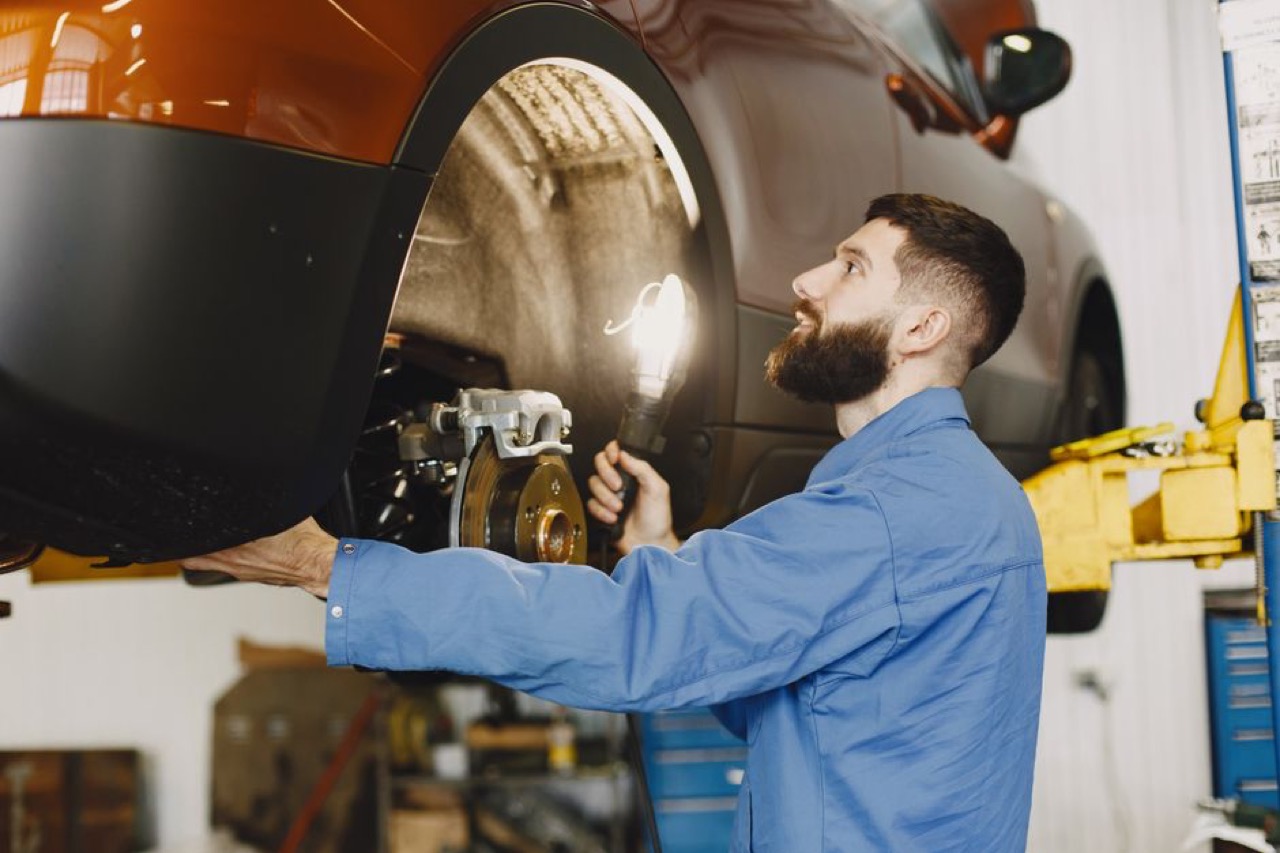 Assessor inspecting car