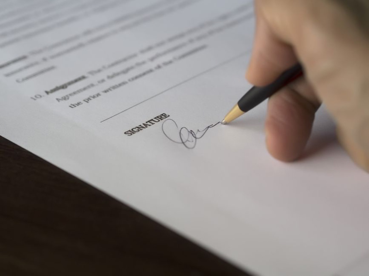 Signing paperwork close up
