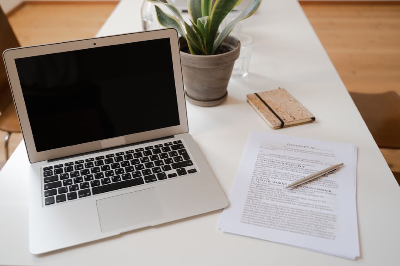 Laptop and documents desk