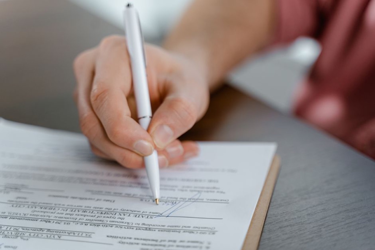 Signing paperwork close up